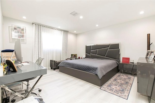 bedroom with light hardwood / wood-style floors