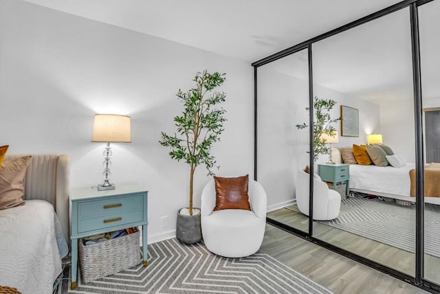 bedroom featuring light hardwood / wood-style flooring and a closet