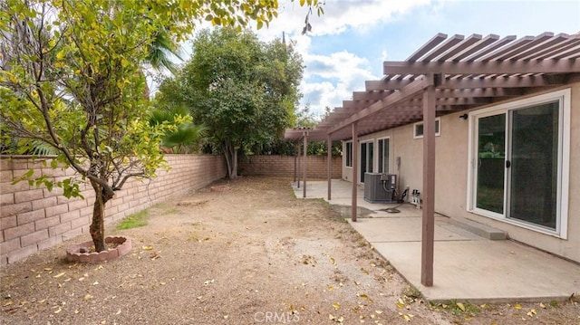 view of yard featuring central air condition unit, a patio area, and a pergola