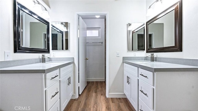 bathroom with hardwood / wood-style floors and vanity