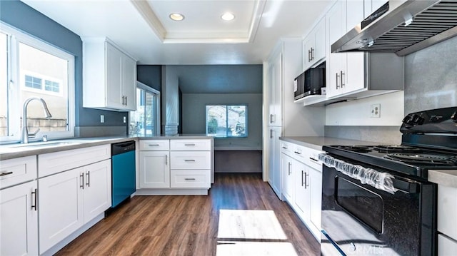 kitchen featuring black appliances, white cabinetry, and a raised ceiling