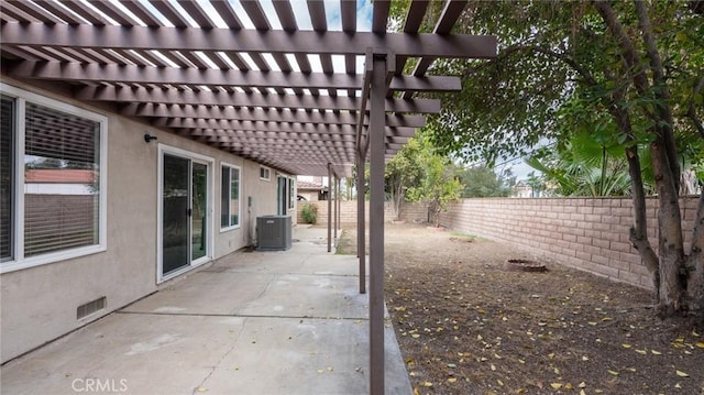 view of patio with cooling unit and a pergola