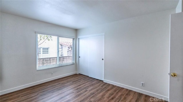 empty room featuring wood-type flooring