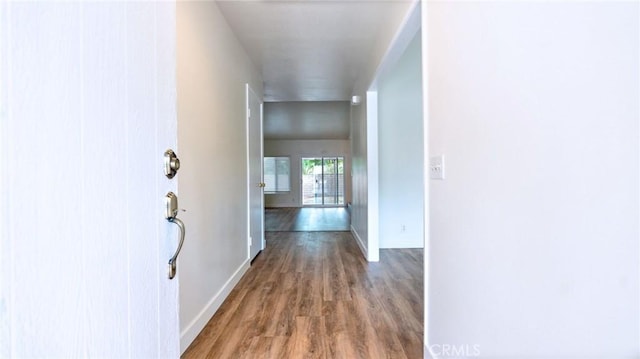 hall with hardwood / wood-style floors