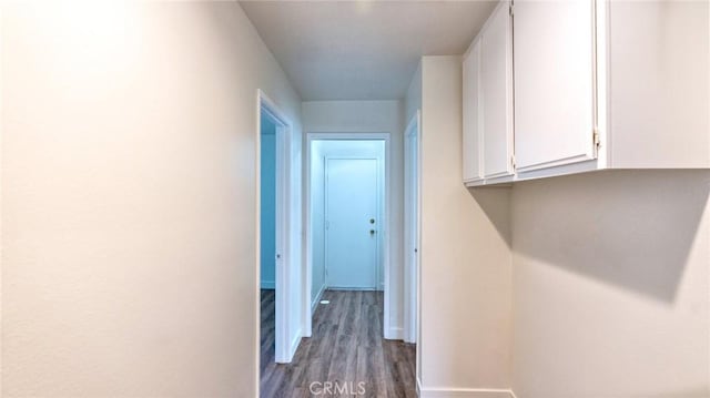 hall with dark wood-type flooring