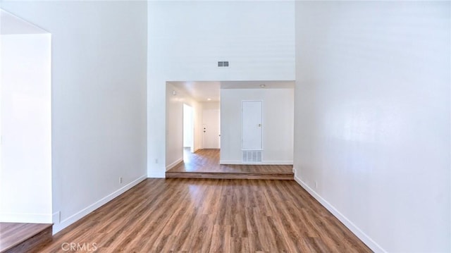 spare room with wood-type flooring