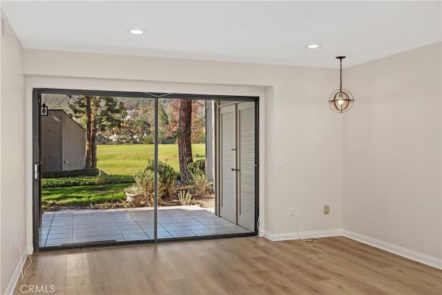 doorway with light wood-type flooring