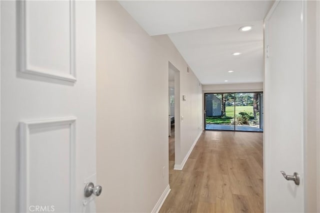 hall with light hardwood / wood-style floors