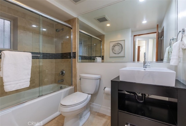 full bathroom with enclosed tub / shower combo, tile patterned floors, toilet, and vanity