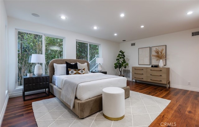 bedroom featuring dark hardwood / wood-style flooring