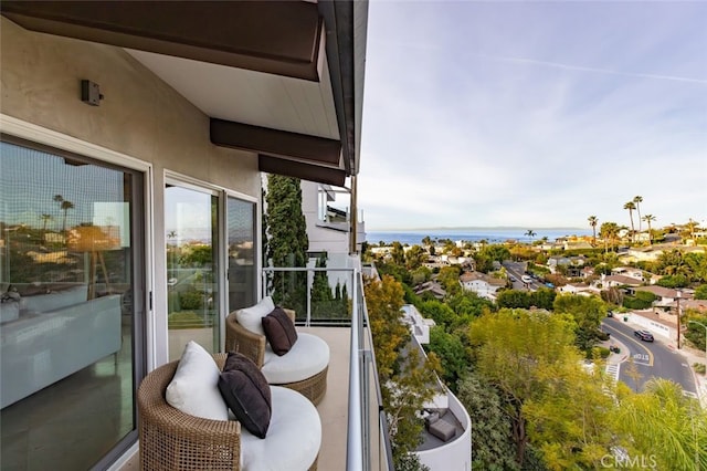 balcony featuring a water view