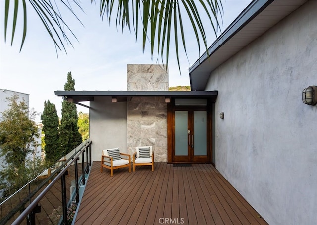 wooden deck featuring french doors