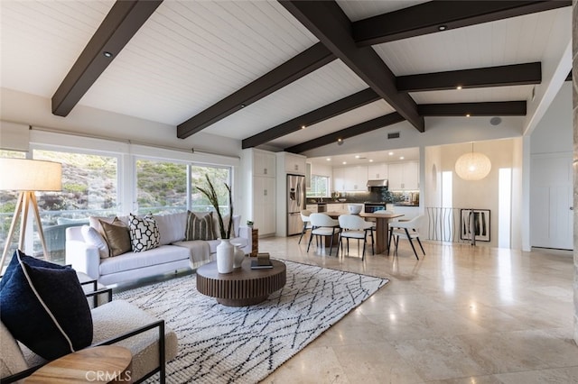 living room with vaulted ceiling with beams and wooden ceiling