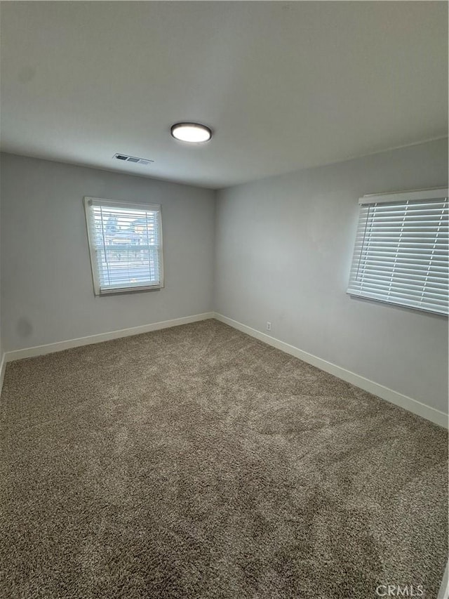 spare room featuring carpet floors