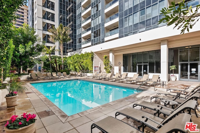 view of swimming pool with a patio