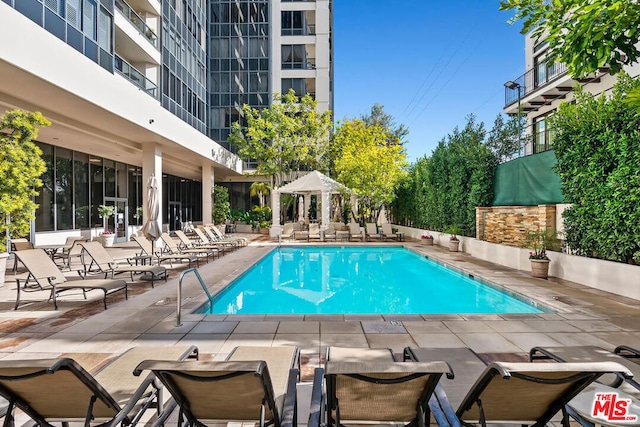 view of pool with a gazebo and a patio area