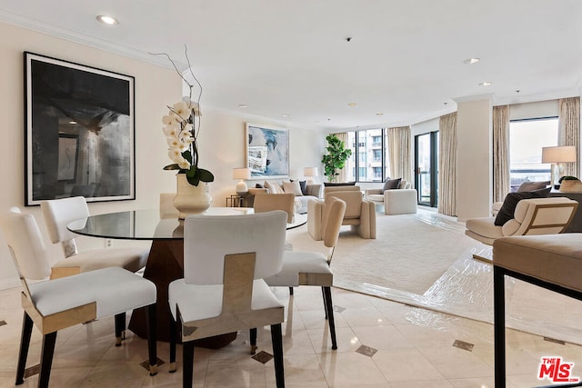 dining space with ornamental molding and light tile patterned floors