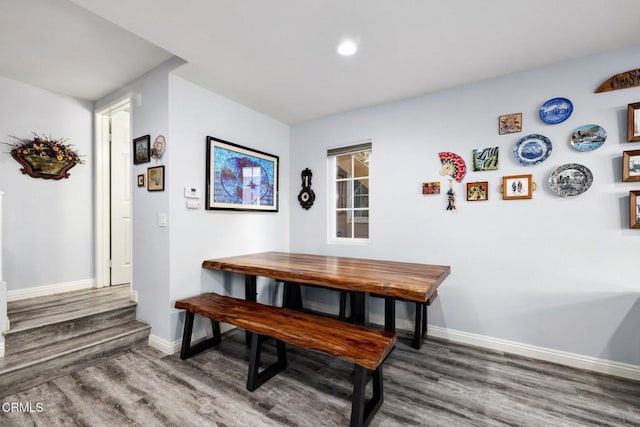 dining area with dark wood-type flooring