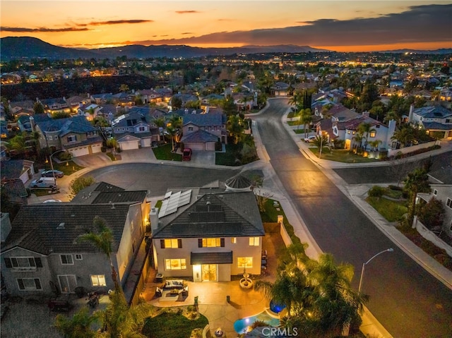 aerial view at dusk with a mountain view