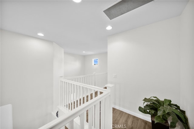 corridor featuring hardwood / wood-style floors