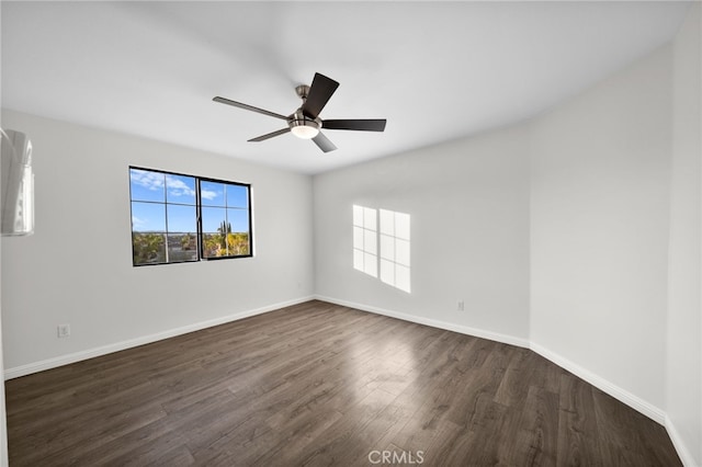 unfurnished room featuring dark hardwood / wood-style floors and ceiling fan