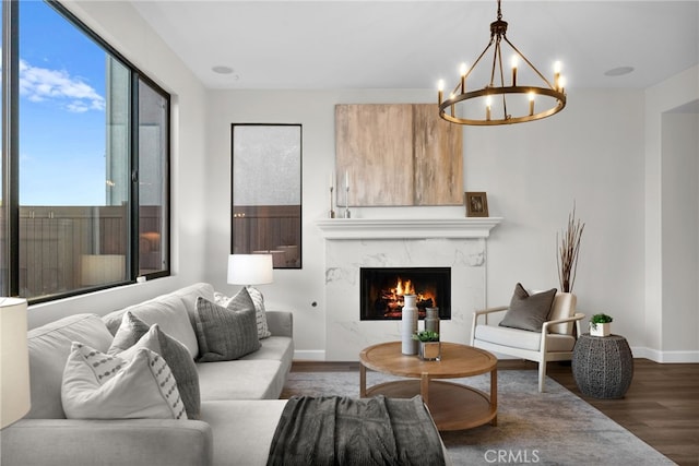 living room featuring dark hardwood / wood-style flooring and a high end fireplace