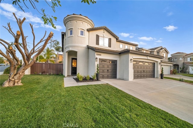 view of front of house with a garage and a front lawn