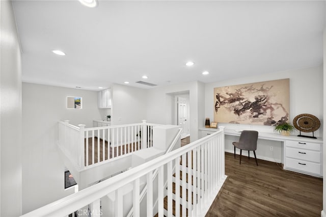 hall with dark hardwood / wood-style flooring