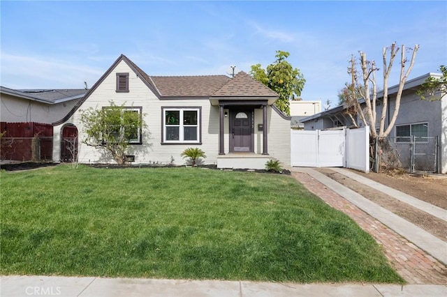 bungalow-style house with a front yard