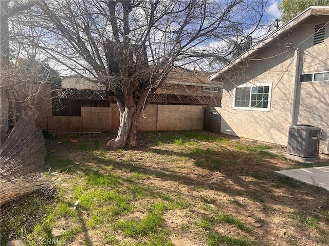 view of yard featuring central AC unit