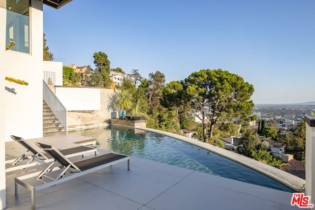 view of pool featuring a patio area