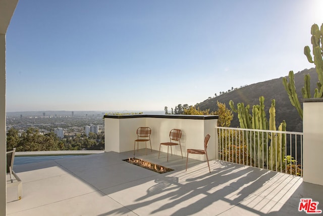 view of patio / terrace with a mountain view