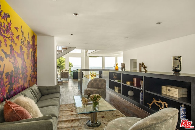 living room with hardwood / wood-style flooring and floor to ceiling windows