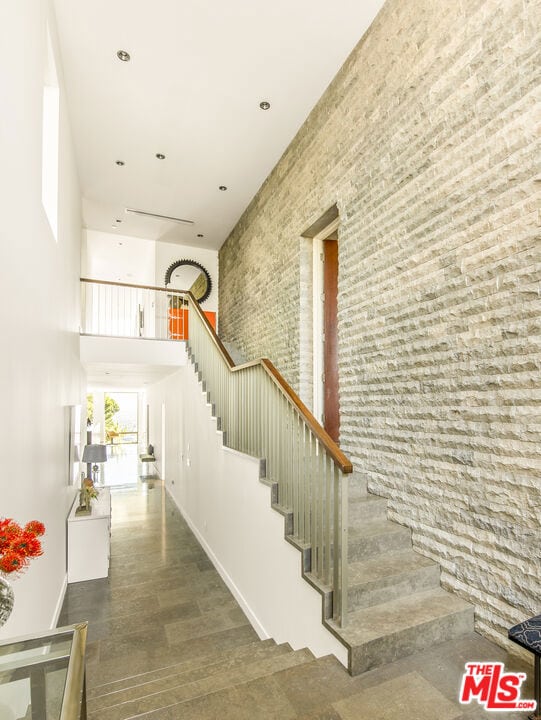 staircase with a towering ceiling