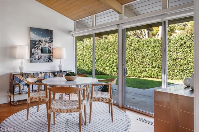 sunroom with vaulted ceiling and a wealth of natural light