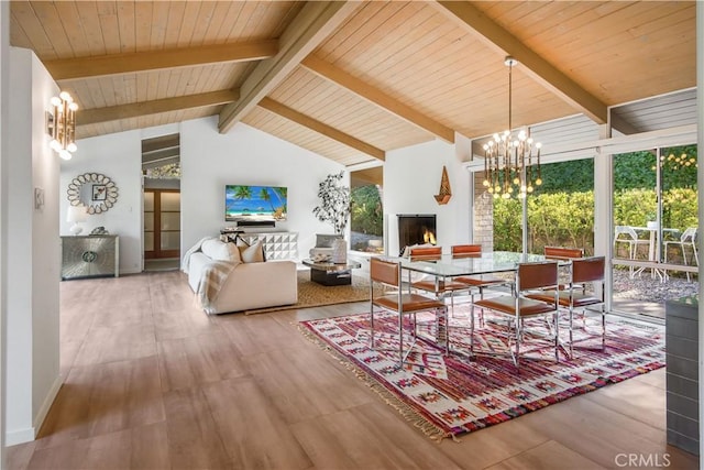 dining area with light hardwood / wood-style flooring, beam ceiling, wooden ceiling, high vaulted ceiling, and a notable chandelier