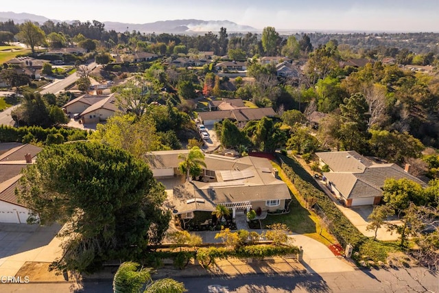 birds eye view of property with a mountain view