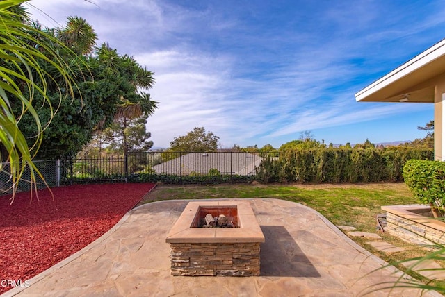 view of patio / terrace with a fire pit