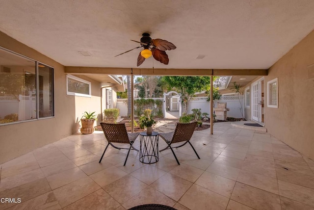 view of patio / terrace featuring ceiling fan