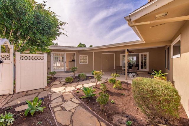 exterior space featuring ceiling fan and french doors