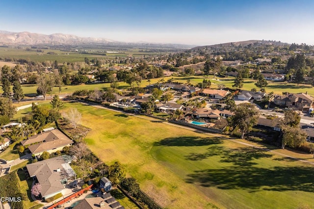 drone / aerial view featuring a mountain view and a residential view