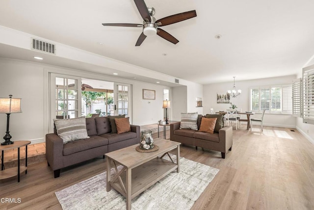 living room with light wood-style flooring, recessed lighting, baseboards, and visible vents