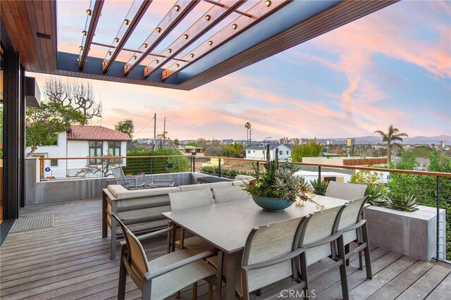 deck at dusk with a pergola