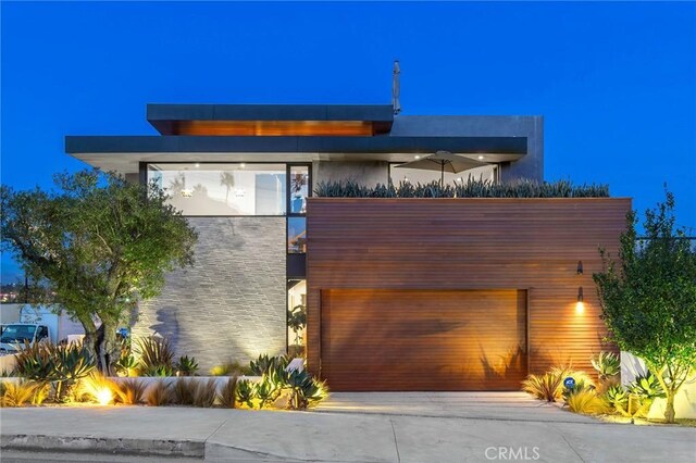 modern home featuring a garage