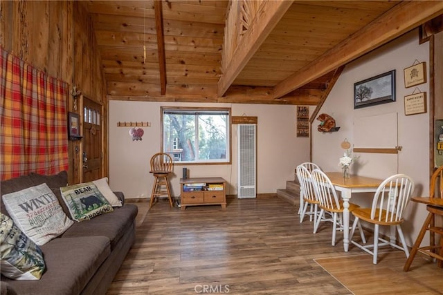 interior space featuring hardwood / wood-style flooring, wooden ceiling, and lofted ceiling with beams