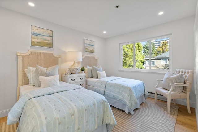 bedroom with light hardwood / wood-style floors