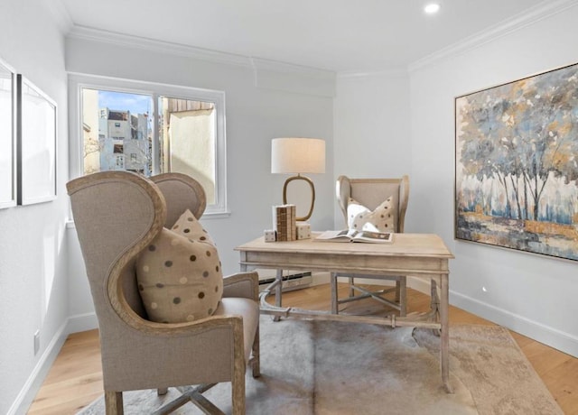 office with crown molding and light hardwood / wood-style floors