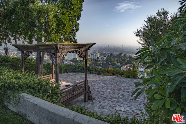 patio terrace at dusk with a pergola