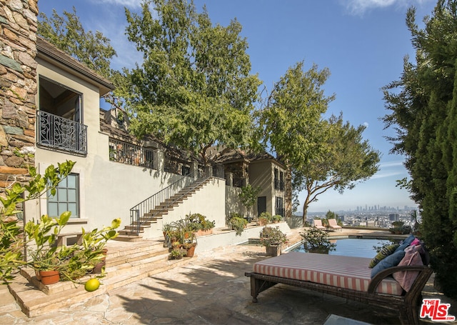 view of patio with a swimming pool