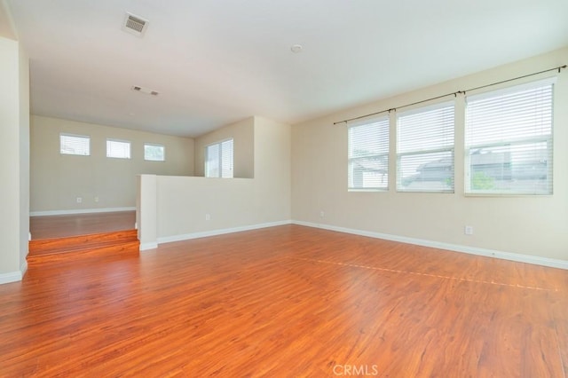 spare room featuring hardwood / wood-style floors